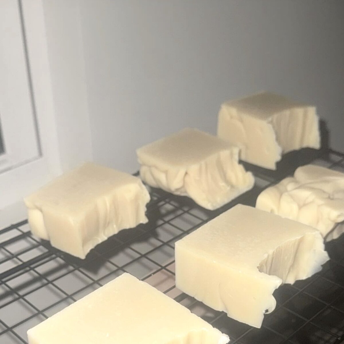 Hand-cut unscented Bare Armor body bars resting on a cooling rack
